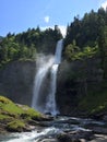 High waterfall in the summer in the french alps Royalty Free Stock Photo