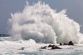 High wave breaking on the rocks Royalty Free Stock Photo