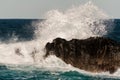 High wave of stormy sea beating the rock