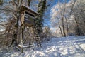 Hunting tower at the edge of the winter forest Royalty Free Stock Photo