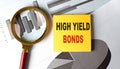 HIGH YIELD BONDS text on sticky on chart, business Royalty Free Stock Photo