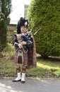 Highland bagpiper in full regalia Royalty Free Stock Photo