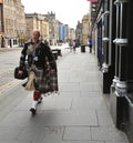 Highland dress is the traditional, regional dress of the Highlands and Isles of Scotland. It is often characterized by tartan Royalty Free Stock Photo