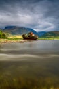 Highlands of Scotland landscape ,abandoned fisherman boat and Ben Nevis at sunset Royalty Free Stock Photo