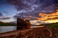 Highlands of Scotland landscape ,abandoned fisherman boat and Ben Nevis at sunset Royalty Free Stock Photo