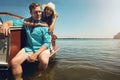 The highlight of their holiday, a relaxing boat ride. Portrait of a young couple spending time together on a yacht. Royalty Free Stock Photo