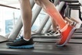Highlighted ankle of man on treadmill Royalty Free Stock Photo
