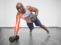 Highlighted arm of strong man lifting weights Royalty Free Stock Photo