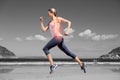 Highlighted back bones of jogging woman on beach Royalty Free Stock Photo