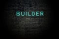 Highlighted brick wall with neon inscription builder