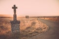 Highlighted cross memorial monument along the side of the road Royalty Free Stock Photo