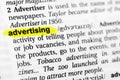 Highlighted English word `advertising` and its definition in the dictionary