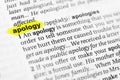 Highlighted English word `apology` and its definition in the dictionary Royalty Free Stock Photo