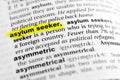 Highlighted English word `asylum seeker` and its definition in the dictionary