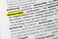 Highlighted English word `autocratic` and its definition in the dictionary