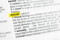 Highlighted English word sexual and its definition at the dictionary. Royalty Free Stock Photo