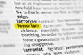 Highlighted English word & x22;terrorism& x22; and its definition at the dictionary Royalty Free Stock Photo