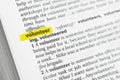 Highlighted English word & x22;volunteer& x22; and its definition at the dictionary Royalty Free Stock Photo