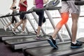 Highlighted knee of man on treadmill