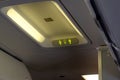 Passenger plane interior details. Highlighted lavatory sign