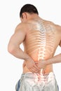 Highlighted spine of man with back pain