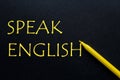 Highlighter Yellow Pen with yellow text Speak English at the black background