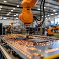 Highlighting automation and modern technology, a yellow robotic arm functions on an industrial assembly line. Royalty Free Stock Photo