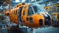 Highlighting the Intricate Assembly Process of an Orange Helicopter Fuselage in a High Tech Aerospace Engineering Royalty Free Stock Photo