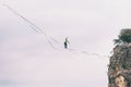 Highliner balances over the abyss Royalty Free Stock Photo