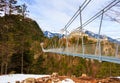Highline 179 longest 406 meters rope bridge in the world in Alps mountains. Tyrol, Austria. Royalty Free Stock Photo