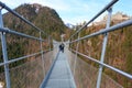 Highline 179 longest 406 meters rope bridge in the world in Alps mountains. Tyrol, Austria. Royalty Free Stock Photo