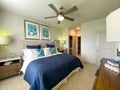 A highly decorated bedroom in a model of an apartment complex