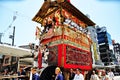 A highly decorated float along with its accompanying men in trad