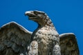 Eagle of stone against a clear blue sky Royalty Free Stock Photo