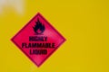 Highly Flammable Liquid Sign against a yellow backround Royalty Free Stock Photo