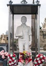 Sculpture of young man with bottle and cigarettes at Poblenou Cemetery