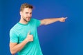 Highly recommend pointing at with index finger. Man unshaven face shows thumbs up gesture violet background. Man Royalty Free Stock Photo