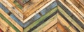A variety of colored recycled wooden pallets cut and arranged in a herringbone pattern Royalty Free Stock Photo