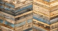 A variety of colored recycled wooden pallets cut and arranged in a herringbone pattern Royalty Free Stock Photo