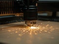 HighPrecision Laser Cutting Machine in Action, Sparks Flying During Cutting Process. Royalty Free Stock Photo