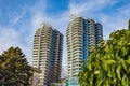 A highrise building against the blue sky. Condominium or apartment building. Looking Up Blue Modern Building Royalty Free Stock Photo