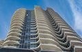 A highrise building against the blue sky. Condominium or apartment building. Looking Up Modern Building