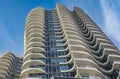 A highrise building against the blue sky. Condominium or apartment building. Looking Up Modern Building Royalty Free Stock Photo