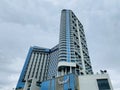 Blue modern luxury glass building low angle on a cloudy sky. Muong Thanh Hotel in Quang Ninh, Vietnam