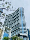 Blue modern luxury glass building low angle on a cloudy sky. Muong Thanh Hotel in Quang Ninh, Vietnam