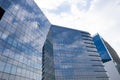 Highrise glass building with sky and clouds reflection. geometric Royalty Free Stock Photo