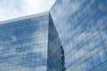 Highrise glass building with sky and clouds reflection. geometric shapes Royalty Free Stock Photo