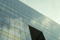 Highrise glass building with sky and clouds reflection. geometric shapes Royalty Free Stock Photo