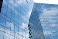 Highrise glass building with sky and clouds reflection. geometric shapes Royalty Free Stock Photo