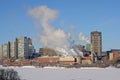 Highrise office towers and industrial buildings n Hull district in winter, along frozen Ottawa river.